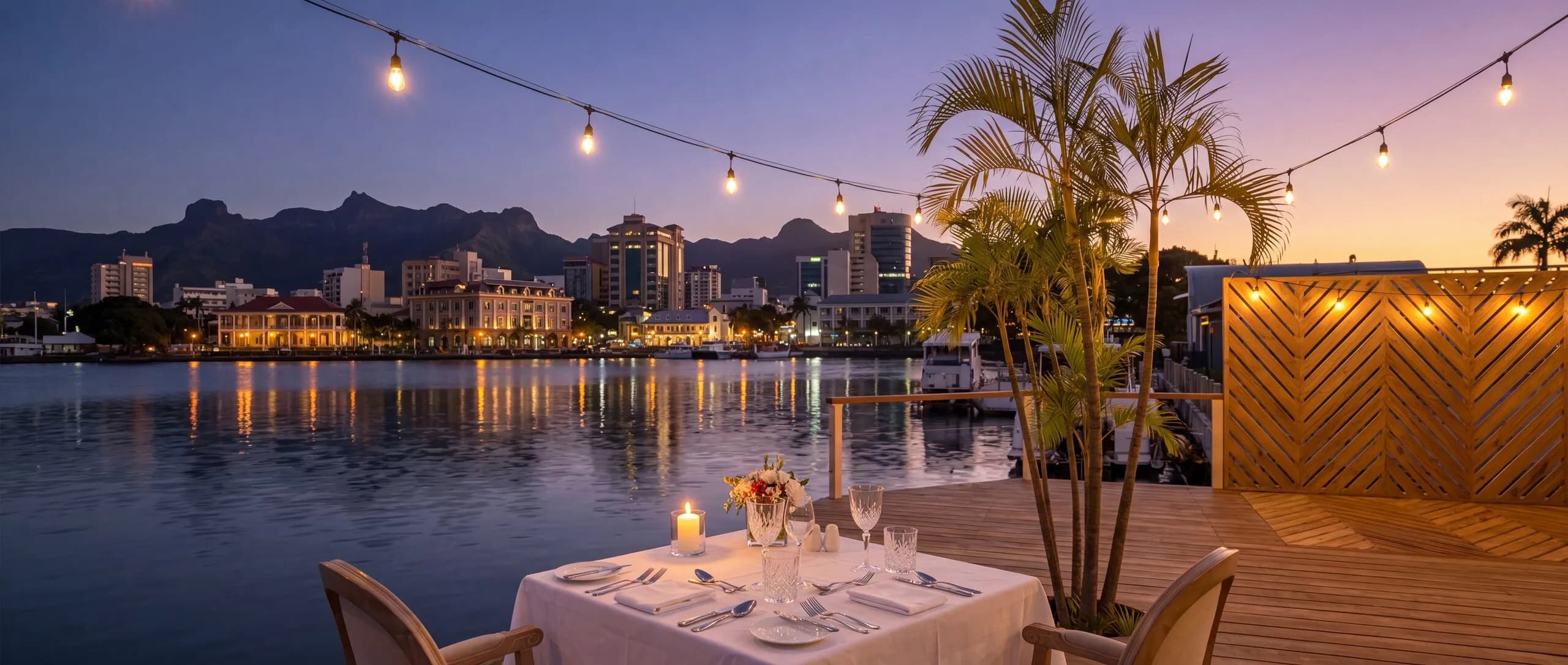 A table kept by the water at Secrets, set for dinner